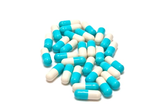 Drug Capsule in Medicine Bottle on a white background.