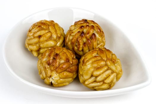 Panellet pine nuts isolated on white