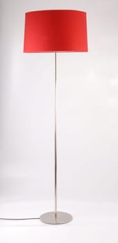 Red contemporary floor lamp isolated on white background