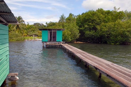 Small wooden house at the end of the bridge