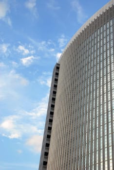 The top of a skyscraper on a blue sky background