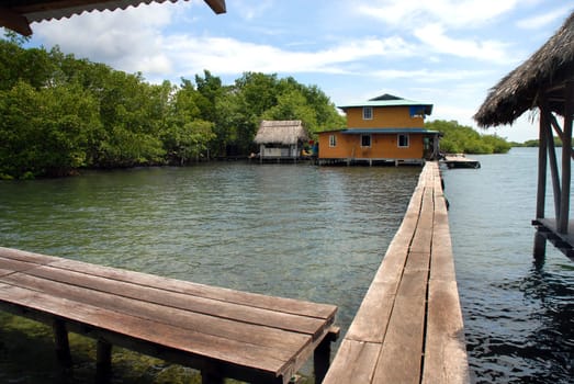 Landscape of a resort with bungalows on the sea.