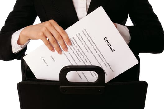 Businesswoman taking out from a suitcase contract for new employees