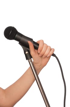 woman holding big black microphone for singing