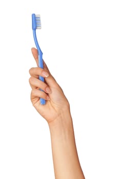 brush for toothpaste at in the girl's hand