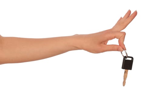 Key from the new house in hands of the woman