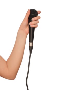 woman holding big black microphone for singing