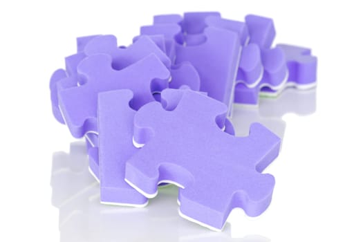 pile of purple puzzle on a white background