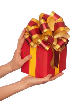 woman giving a red box with yellow bow as a gift