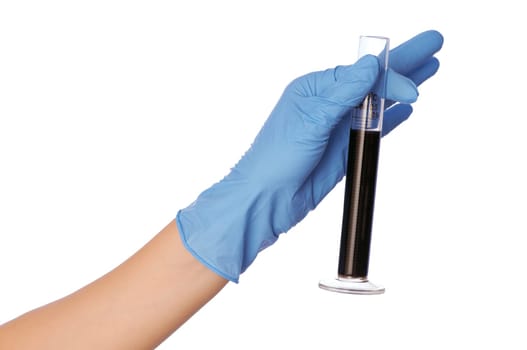 Woman in blue gloves holding sample of fractions of oil typed in a tube for experiments in the hand