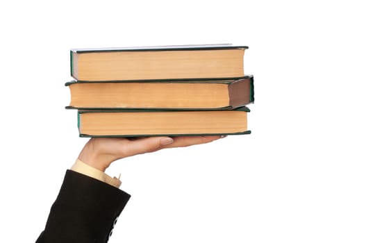 The woman in a business suit, shows old business books for notes