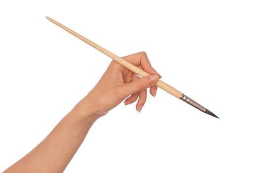 woman drawing a picture with a brush