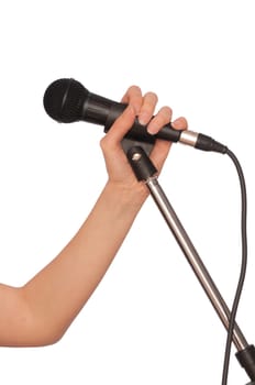 woman holding big black microphone for singing