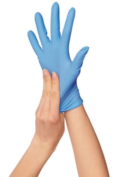 Doctor putting on blue sterilized medical glove for making operation