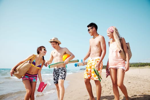 group of young people going to the beach