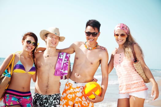 group of young people going to the beach