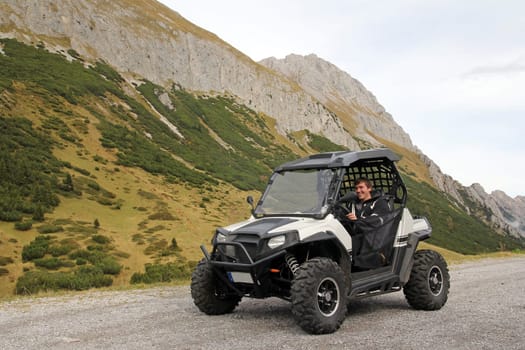 With the buggy over the Alps
