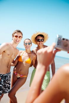 group of young people taking a photograph