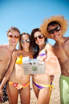 group of young people taking a photograph
