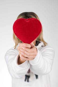 Red heart holding by female