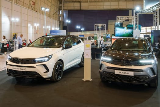 Lisbon, Portugal - May 12, 2023: Opel Grandland GSe hybrid and Opel Mokka electric cars on display at ECAR SHOW - Hybrid and Electric Motor Show