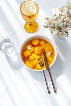 Salmon ceviche in jelly with orange and mango-passion fruit sauce. High quality photo