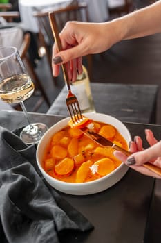 Salmon ceviche in jelly with orange and mango-passion fruit sauce. High quality photo