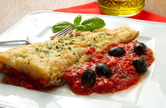 cooked cod loins with home made tomato sauce and oil