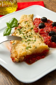 cooked cod loins with home made tomato sauce and oil