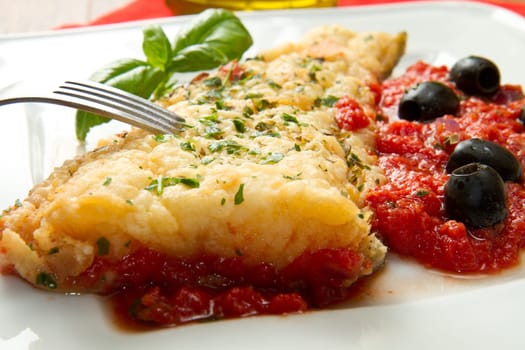 cooked cod loins with home made tomato sauce and oil