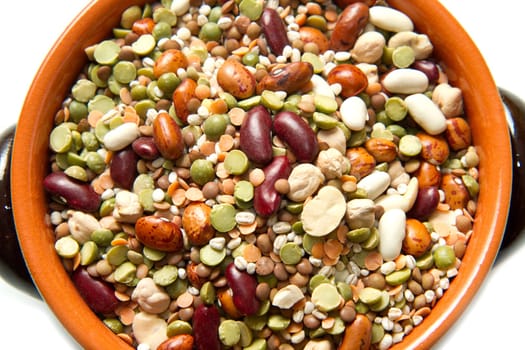 vegetables in crock pot on white background