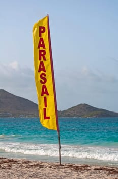 Stock photo of a parasail flag at Caribbean beach.