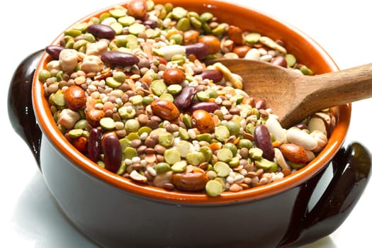 vegetables in crock pot on white background