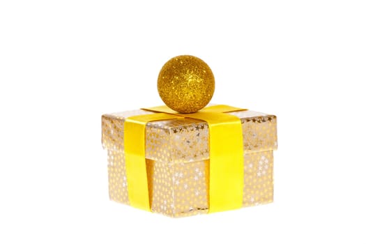 Christmas package with golden ball against white background