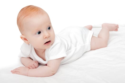 Cute Baby Girl Lying on Front on White Background