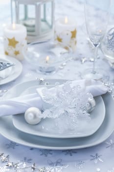 Place setting in white and silver for Christmas with snowflake