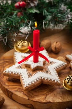 Homemade gingerbread candle for Christmas with jingle bells
