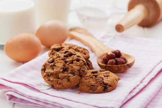 Christmas cookies with glass of milk and baking ingredients