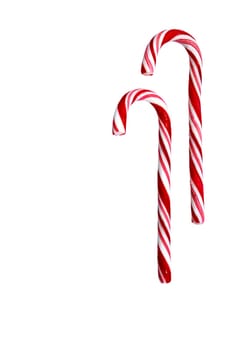 Two candy canes isolated on white background. Christmas, holiday concept. Space for copy. Useful as greeting card. Clipping path included.