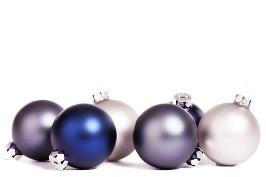 Blue and silver Christmas tree balls on white background