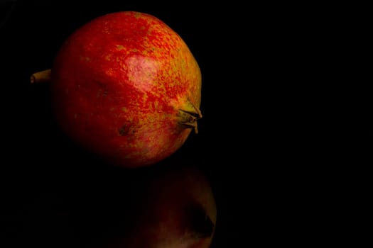 Pomegranate with reflection