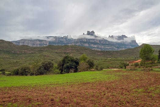 Montserrat mountain and valley fog. Famous mountain of Catalonia, Spain