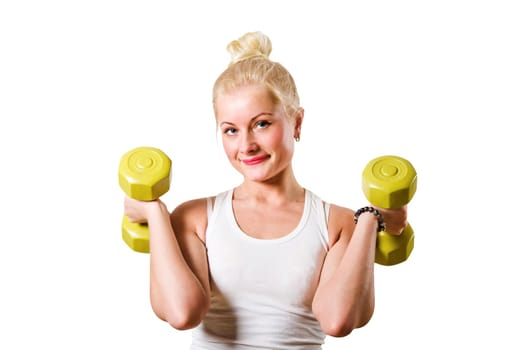 The young woman is engaged with dumbbells