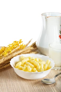 Breakfast. A glass of milk and the corn sticks