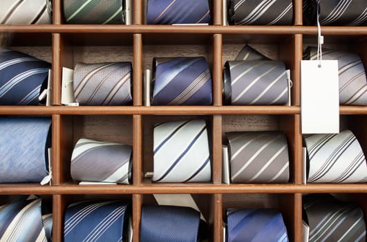 A lot of ties in the wooden box