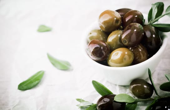 Bowl filled with fresh black olives served as an accompaniment or appetizing snack with copyspace