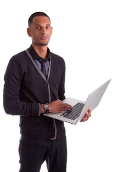 Young african american man using a laptop, isolated on white background