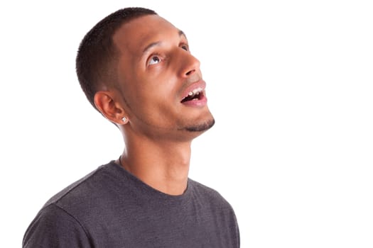 Close up portrait of a young african american man looking up, isolated on white background
