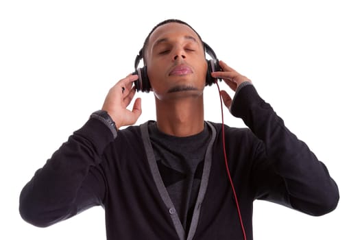 Young black man with closed eyes listening to music, isolated on white background