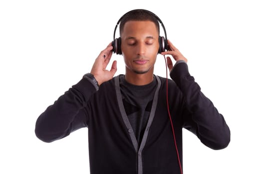 Young black man with closed eyes listening to music, isolated on white background